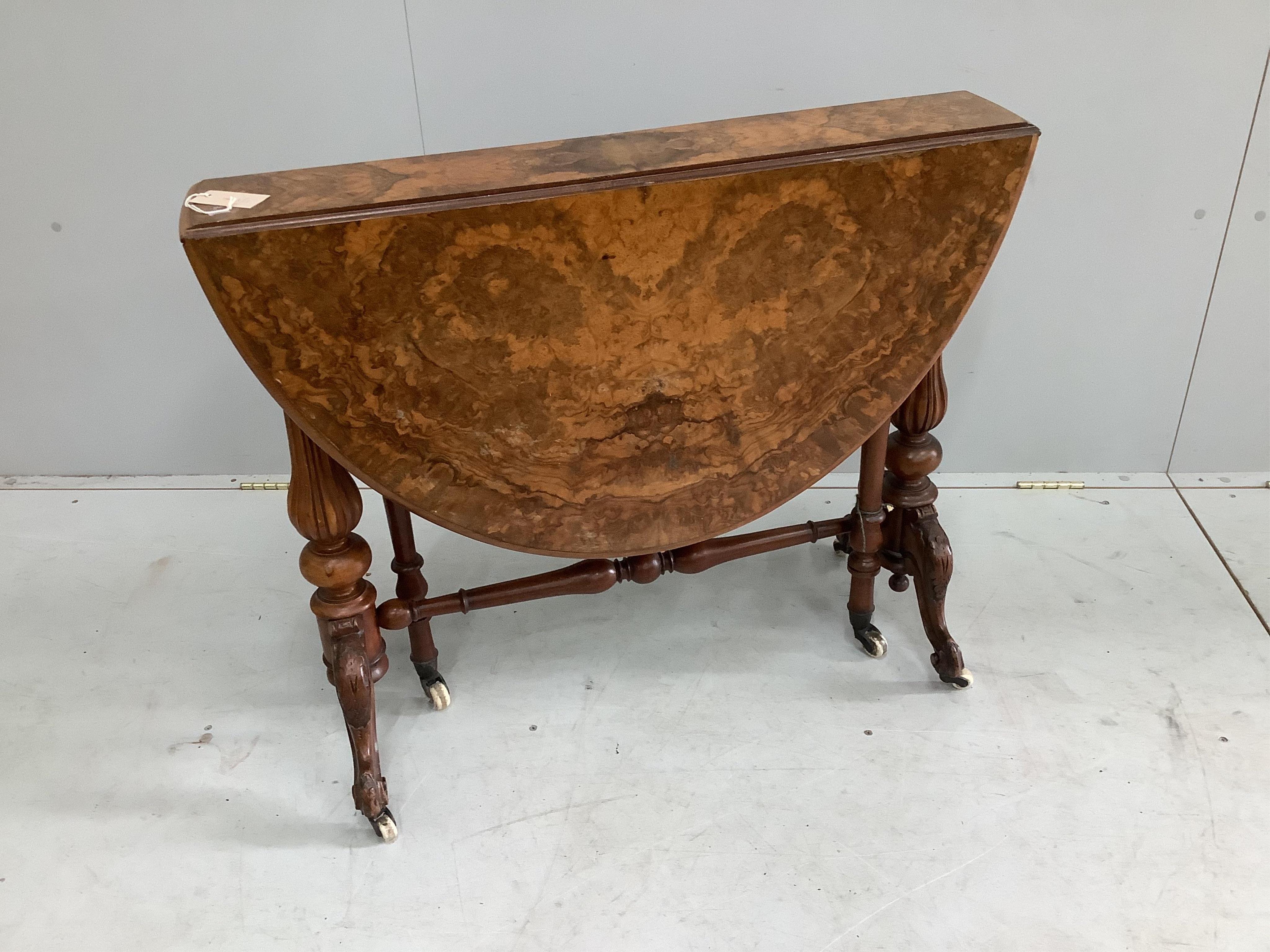 A Victorian figured walnut Sutherland table, width 88cm, depth 18cm, height 73cm